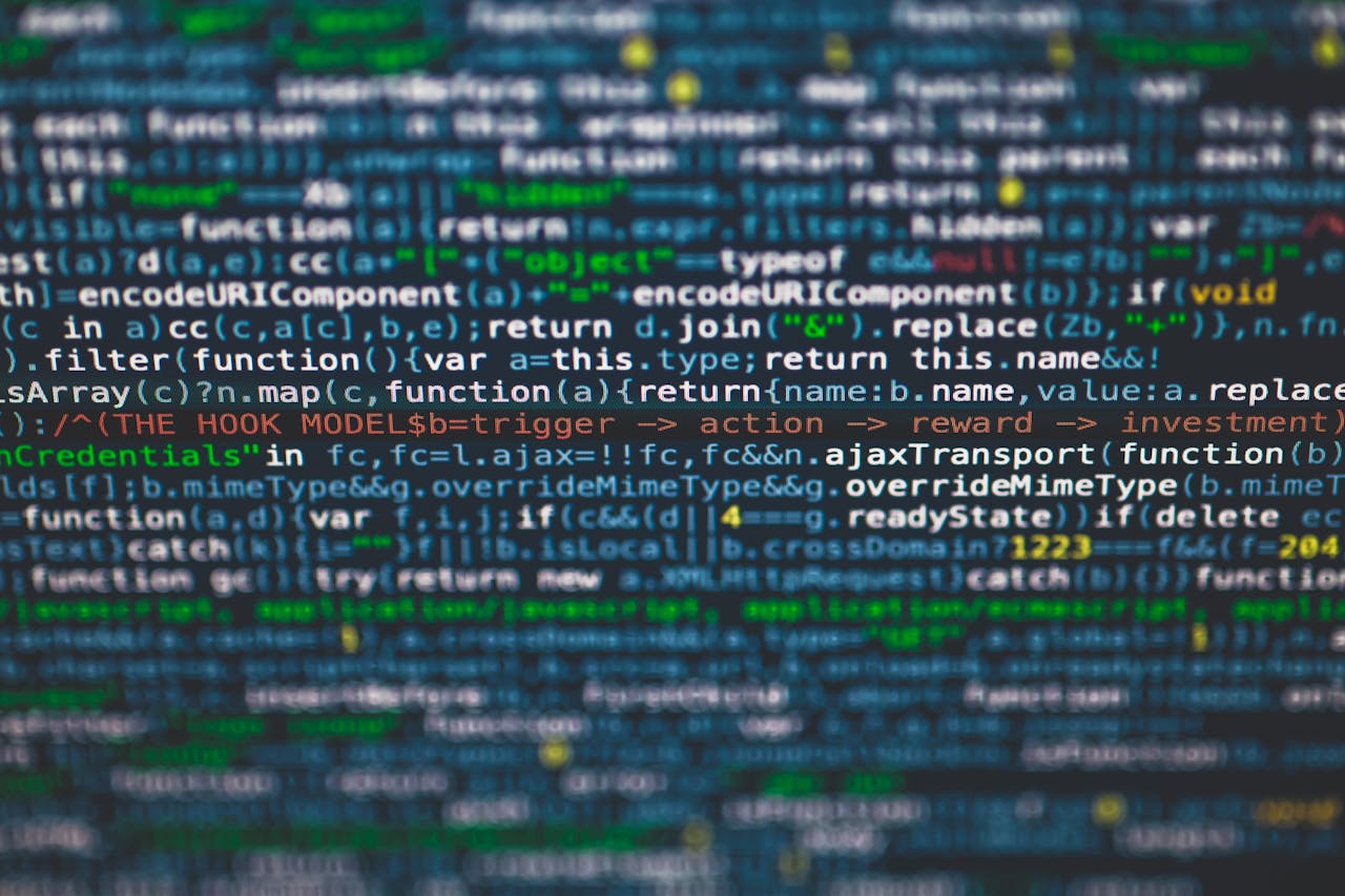 Home Detailed view of colorful programming code on a computer screen.
